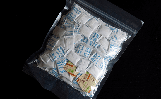 Use silica gel packets to dry out iPhone